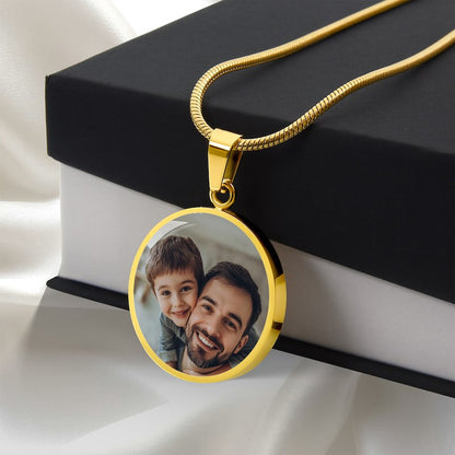 Personalized gold circle photo pendant necklace with father and son image displayed on gift box