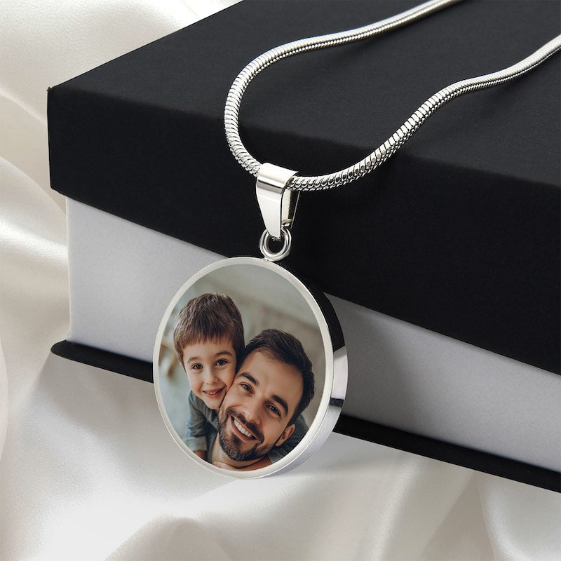 Personalized silver circle photo pendant necklace with father and son image displayed on gift box