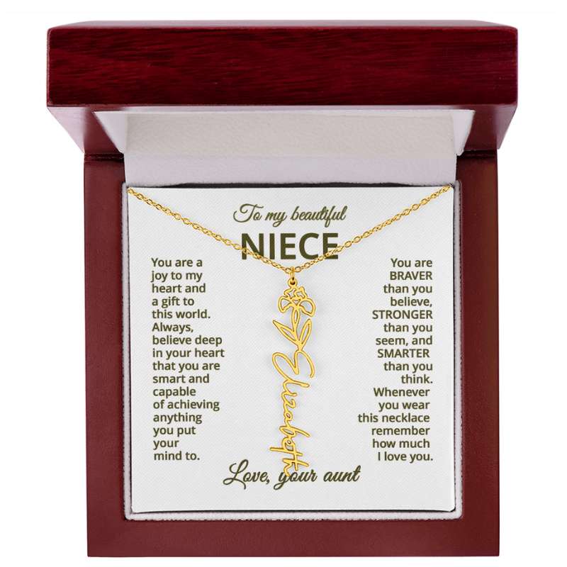 Gold necklace with iris flower design with a sentimental message card for niece in a wooden box.
