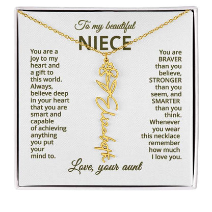 Gold necklace with iris flower design with sentimental message for niece on a white card
