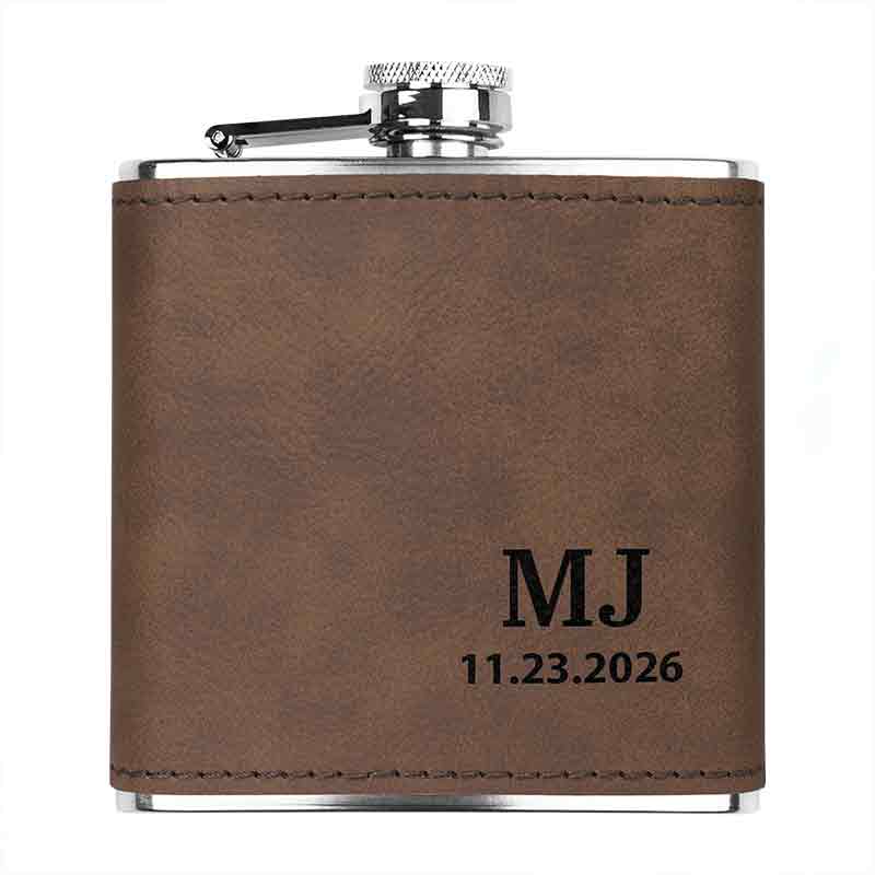 Stainless steel custom engraved flask in dark brown color, showing custom initials and date engraving.