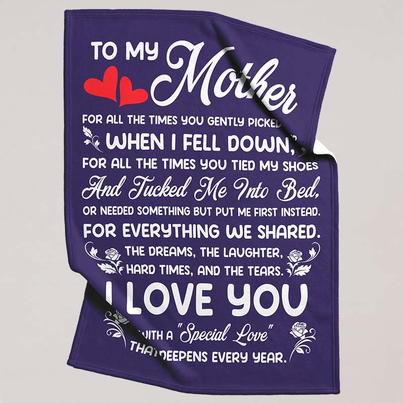 Decorative purple blanket with rose design and a heartfelt message for mother, on a beige background