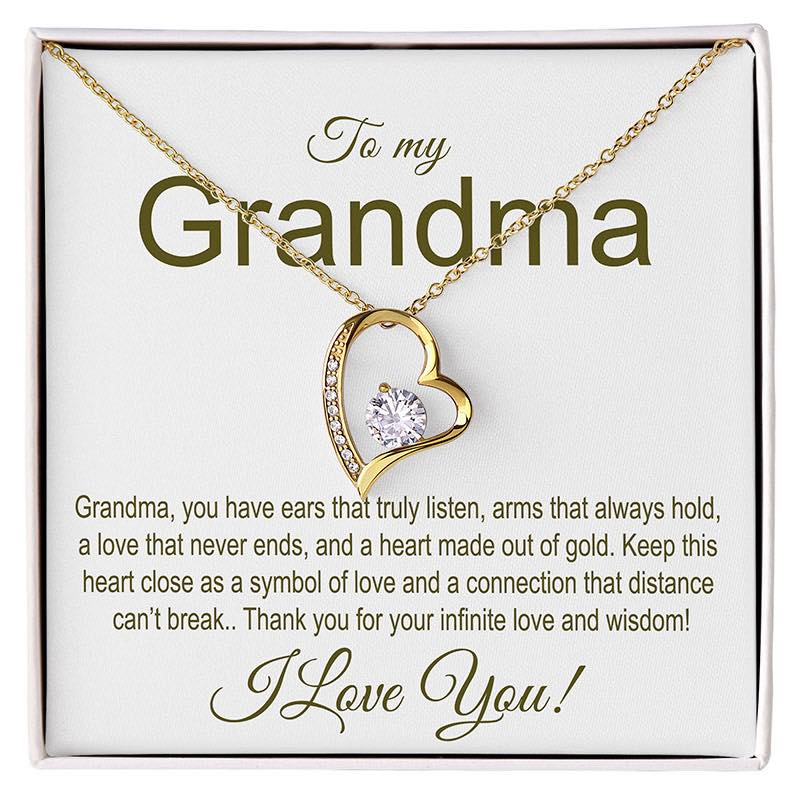 Gold heart-shaped necklace with a message card for grandma on a white background