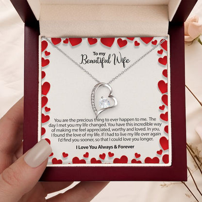 to my wife gifts - heart-shaped necklace in a box with a sentimental message for a wife in a burgundy box on a beige background.