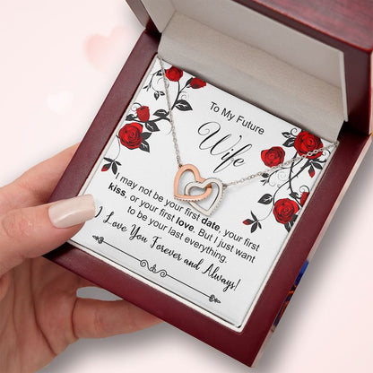 Necklace with interlocking hearts in a box with a message for 'Future Wife' on a pink background.