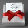 A gift box wrapped with a red satin ribbon bow and a custom gift card reading "your message here."
