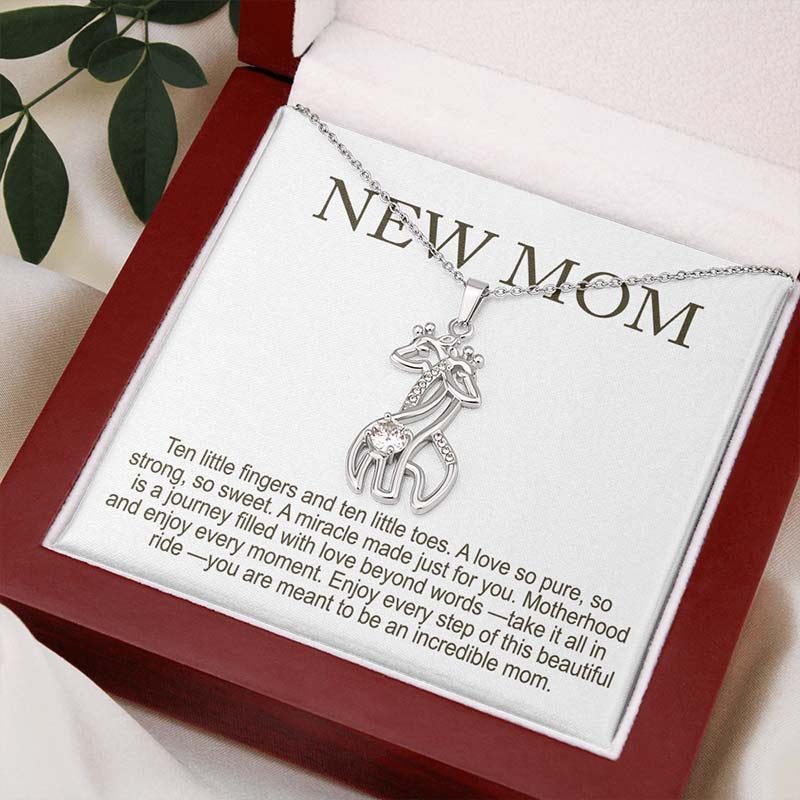 unique gifts for new moms: silver giraffe pendant necklace with crystal accents displayed in a red luxury gift box with “New Mom” message card