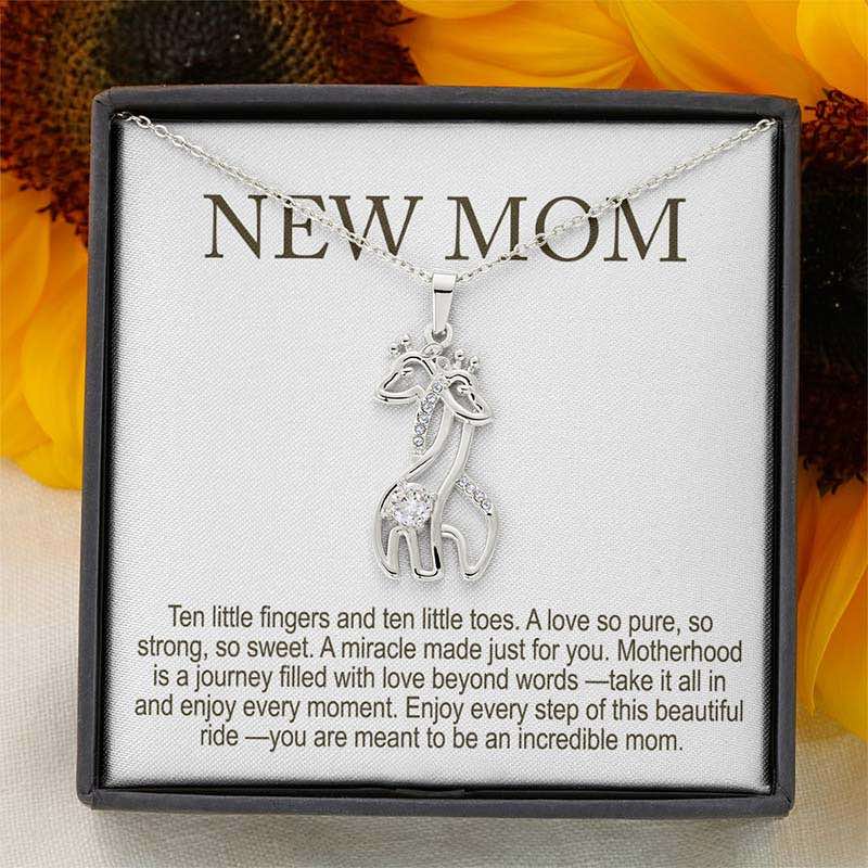 best new mom gifts: silver giraffe pendant necklace with crystals on a delicate chain, displayed in a gift box with “New Mom” message card