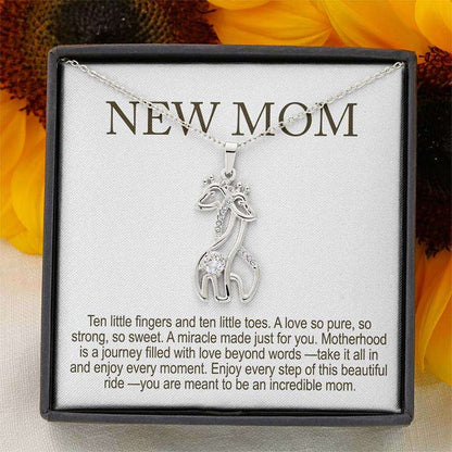 best new mom gifts: silver giraffe pendant necklace with crystals on a delicate chain, displayed in a gift box with “New Mom” message card
