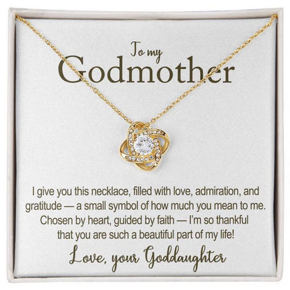 Gold necklace with heart-shaped pendant on a card for a godmother, featuring a heartfelt message.