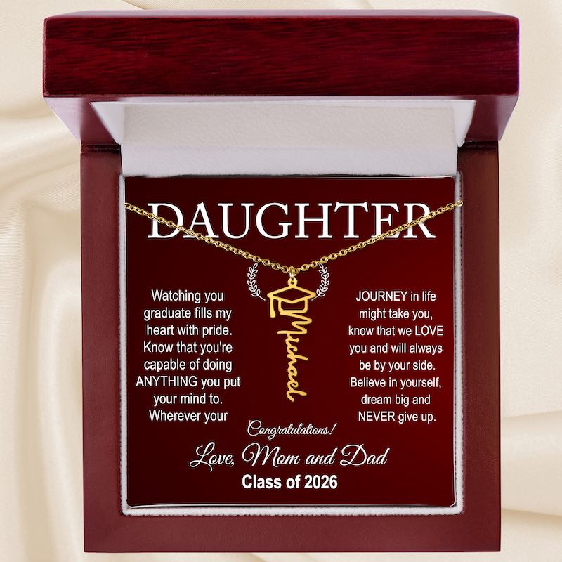 Daughter graduating gifts: Graduation-themed necklace with sentimental message for a daughter, displayed in a box.

