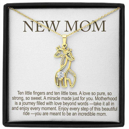 new mom gifts: gold giraffe pendant necklace with sparkling stones displayed in a gift box with “New Mom” message card