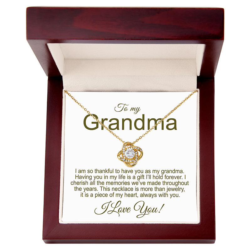 Gold knot necklace with sentimental message card in a mahogany gift box for 'Grandma'.