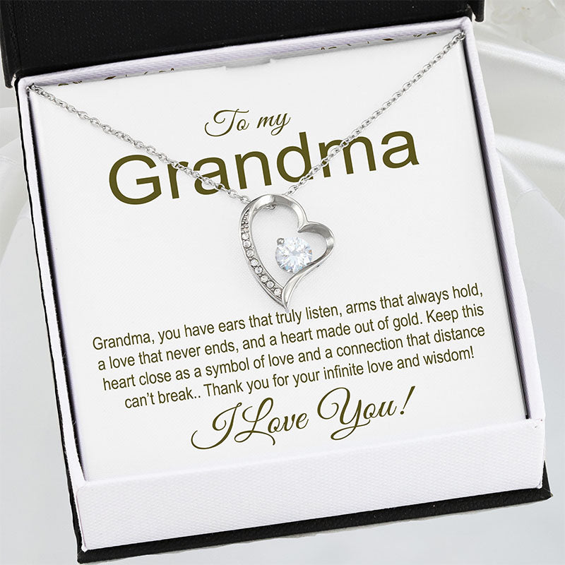 Heart-shaped necklace in a gift box with a message for a grandma