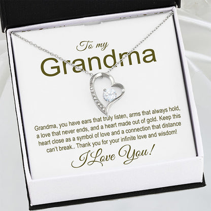 Heart-shaped necklace in a gift box with a message for a grandma