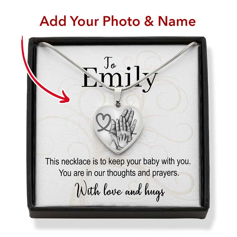 Silver necklace with heart-shaped pendant in a box, personalized for Emily.