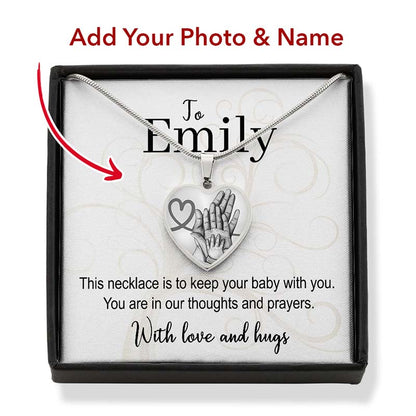 Silver necklace with heart-shaped pendant in a box, personalized for Emily.