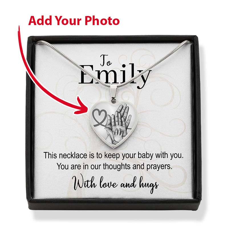 Necklace with heart-shaped pendant in a box, personalized for a mom who lost a baby.