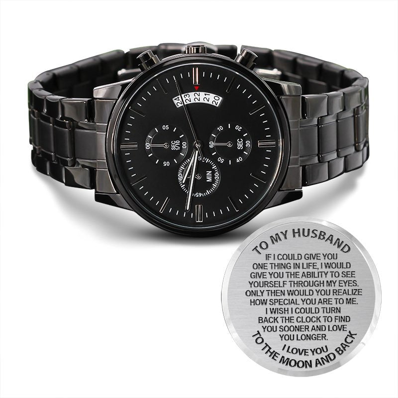 Black wristwatch with a sentimental message engraving on a white background that reads 'To My Husband I love You To The Moon and Back"