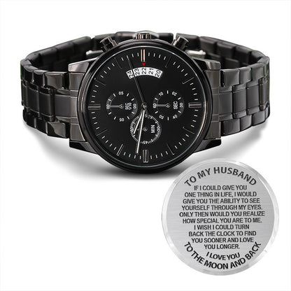 Black wristwatch with a sentimental message engraving on a white background that reads 'To My Husband I love You To The Moon and Back"