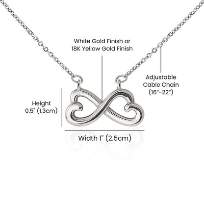 Size chart for the infinity heart necklace, showing a 1" width, 0.5" height, and an adjustable 16"-22" cable chain.