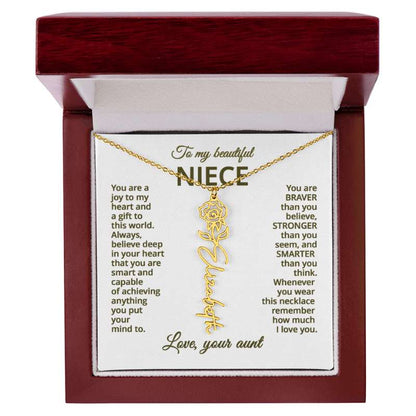 Gold name necklace with rose flower design on a personalized card message for niece in a wooden box.