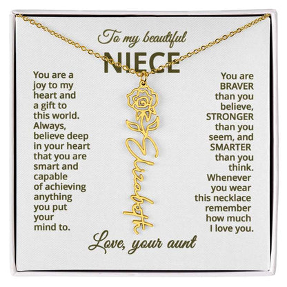 Gold name necklace with rose flower design on a personalized card message for niece in a white box