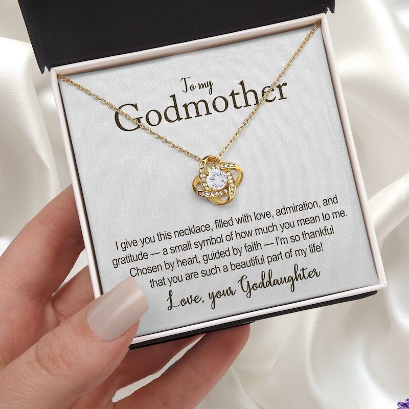 Gold heart-shaped necklace with a message card for a godmother