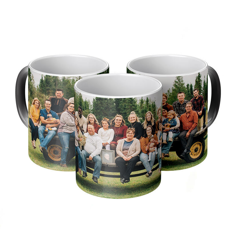 personalized mugs: three custom changing color mugs with a printed design of a group of people on a tractor.