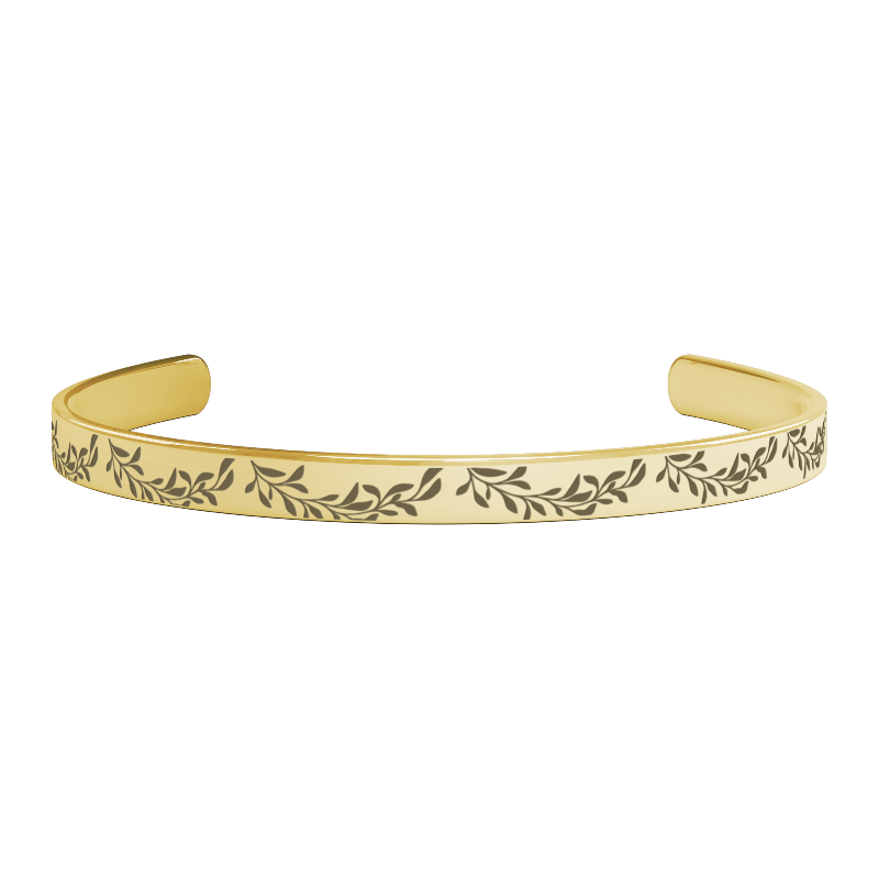 unique thoughtful bridesmaid gifts - gold bracelet with leaf pattern on a white background
