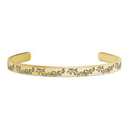 unique thoughtful bridesmaid gifts - gold bracelet with leaf pattern on a white background