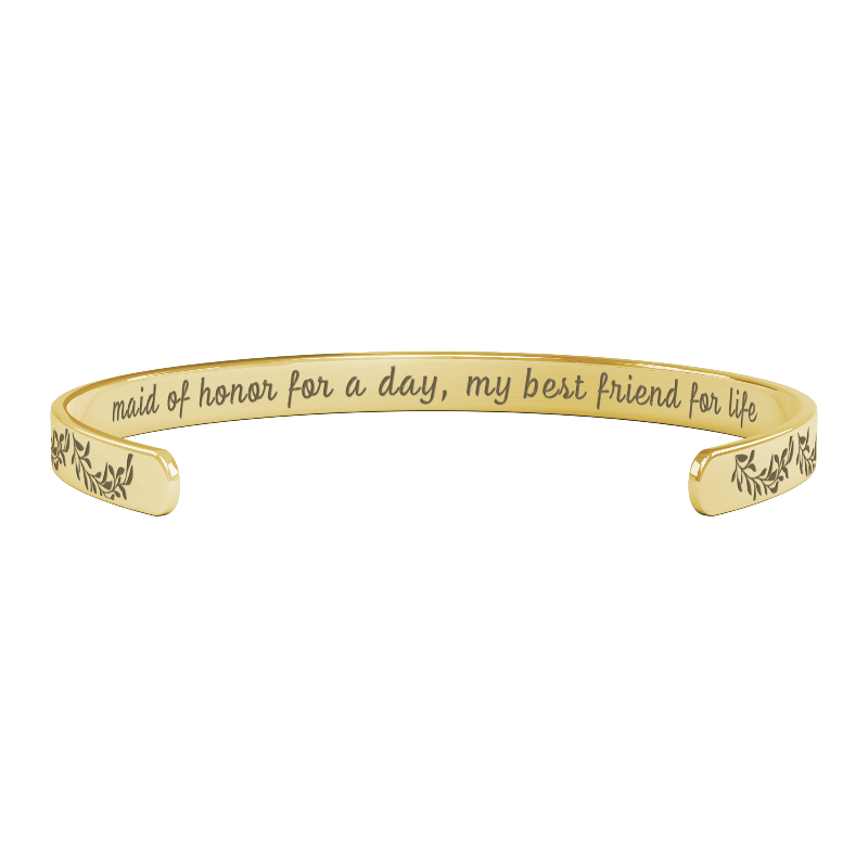sentimental bridesmaid gifts - gold bracelet with engraved text on a white background