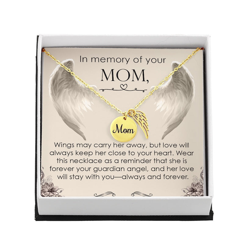 Necklace with angel wings and 'Mom' pendant in a decorative box with sentimental message.