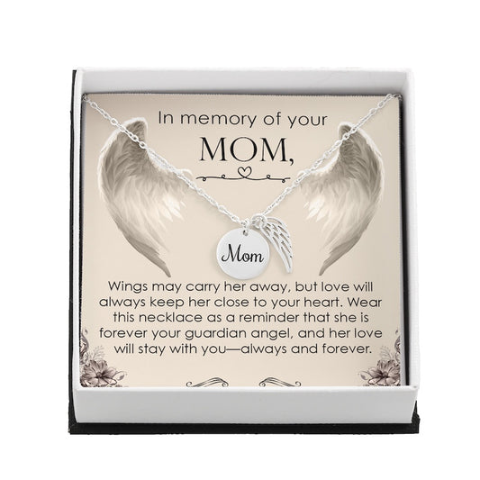 Necklace with angel wings and 'Mom' charm in a gift box with sentimental message.
