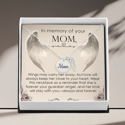 Necklace with angel wings and 'Mom' charm in a decorative box with sentimental text.