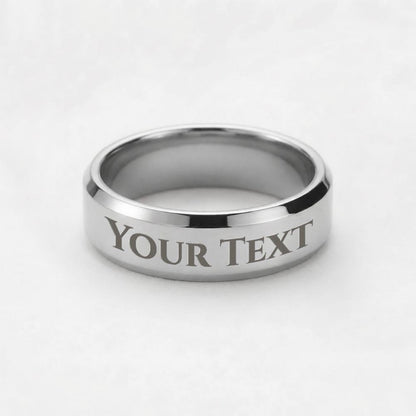 Silver ring with 'YOUR TEXT' engraving on a white background.