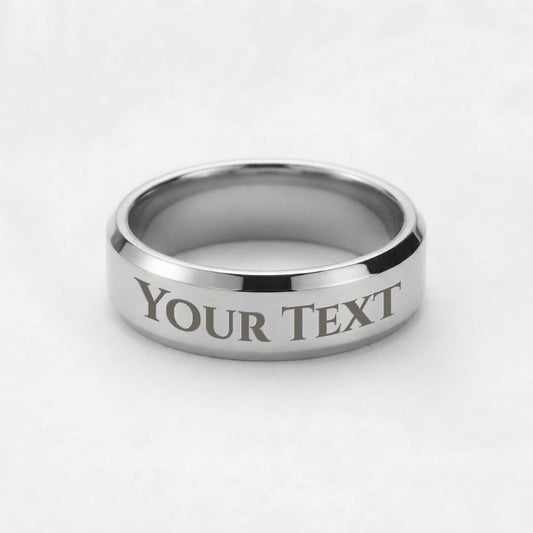 Silver ring with 'YOUR TEXT' engraving, displayed on a white background.