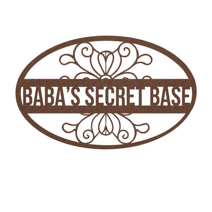 Decorative copper metal sign with 'Baba's Secret Base' text on a white background