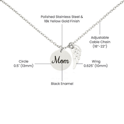 Necklace with 'Mom' pendant and wing charm on a white background