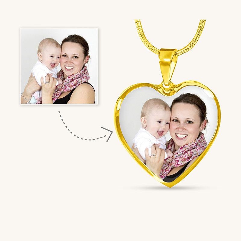mom photo necklace: heart-shaped photo pendant with a gold chain featuring a woman holding a baby.