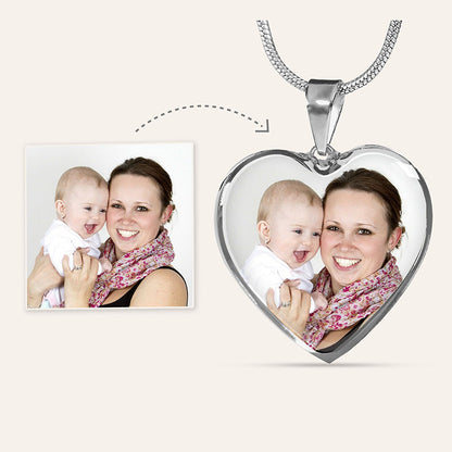 mom personalized engraved necklace: heart-shaped photo pendant silver with a woman and child, next to the photo necklace there is the photo for personalization.