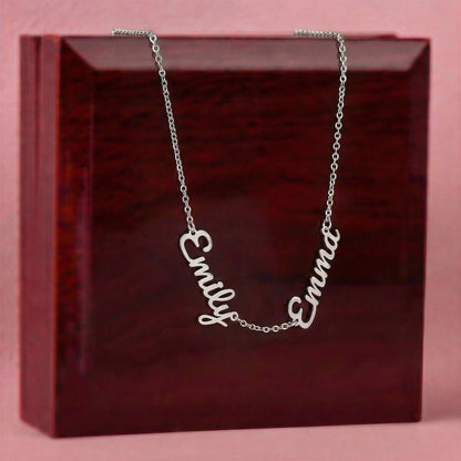 Silver necklace with 'Emily' and 'Emma' on a red box