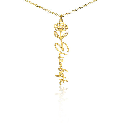 Gold flower birth name necklace with
November birth flower chrysanthemum pendant and custom 'Elizabeth' engraving on a white background