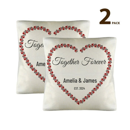 Two decorative pillows with floral heart design and text 'Together Forever' on a white background.
