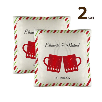Two decorative pillows with christmas red mugs design and personalized text on a white background.