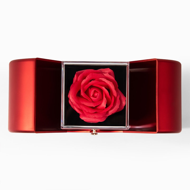 Red rose in a red box on a white background