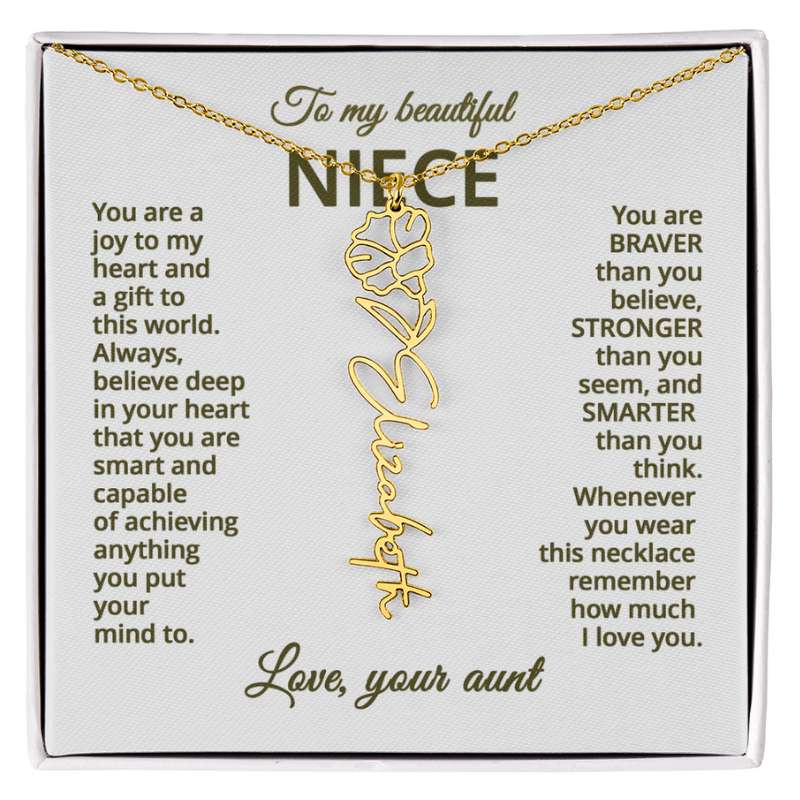 Gold name necklace and morning glory flower pendant on a card with sentimental message for niece on a hite background 