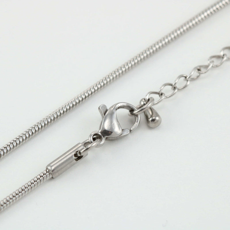 Close-up of a silver snake necklace chain with a lobster clasp, indicating the product is a replacement attachment for jewelry making.