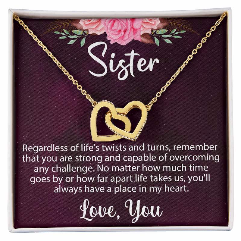 Sister birthday gifts: A gold interlocking heart necklace in a gift box with a heartwarming message card for a sister.