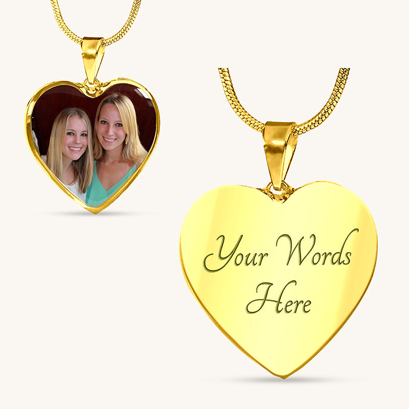 Gold heart-shaped pendant with 'Your Words Here' engraving and another pendant with a photo of two women.